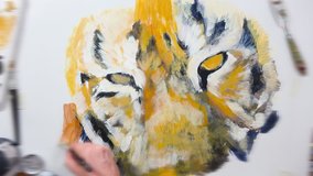 Artistic hand-painting of a tiger's eye, video session