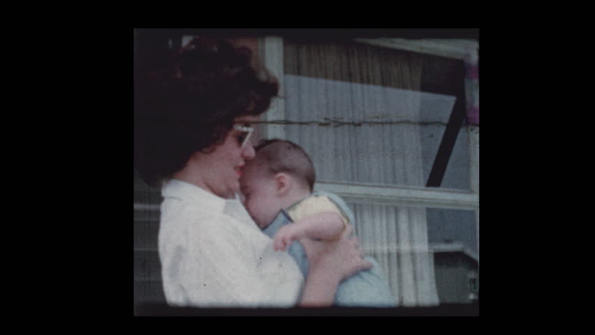 1959 Stylish Women wearing sunglasses holding cute infant baby boy Royalty-Free Stock Footage #1023437590