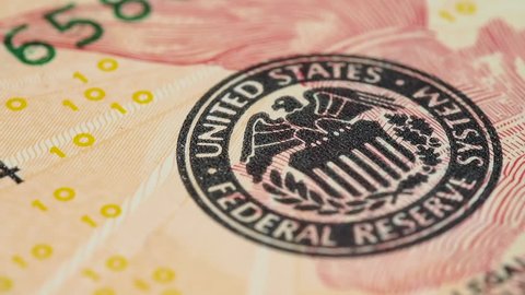 Federal Reserve System Seal on US 10 dollar bill macro slow rotating. Low angle. Stock video footage