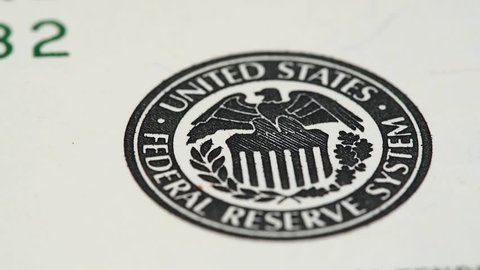 Federal Reserve System Seal on US 100 dollar bill macro slow rotating. Low angle. Stock video footage