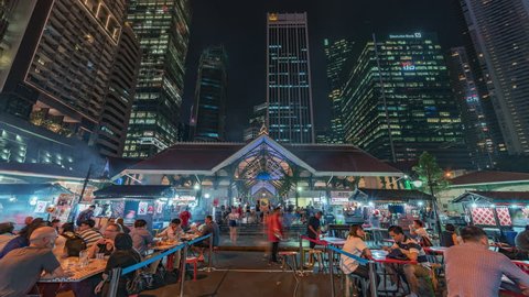 2018-09-05 | Singapore | 4K Timelapse Sequence of Singapore - The Downtown outdoor food court at Night (front view)