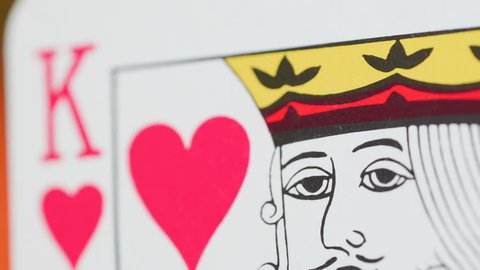 Macro shot of the red King of Hearts card while spinning around