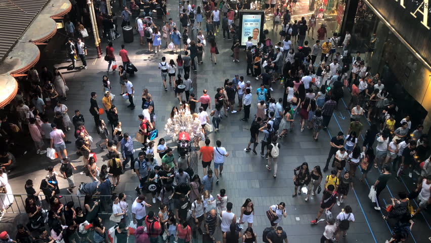 Sydney, Australia, December 2018: Time lapse of Crowds of People  walking through Sydney streets on a Boxing day