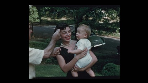 Glam 50s mom baby and grandfather coax baby to come to him 1953