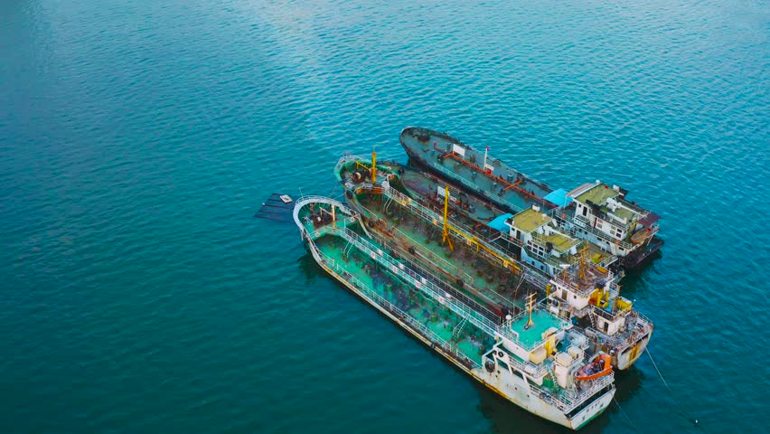 Aerial view of ocean scape and cityscape with buildings in shenzhen china,cargo ships anchord in the port,yacht galloped over the sea