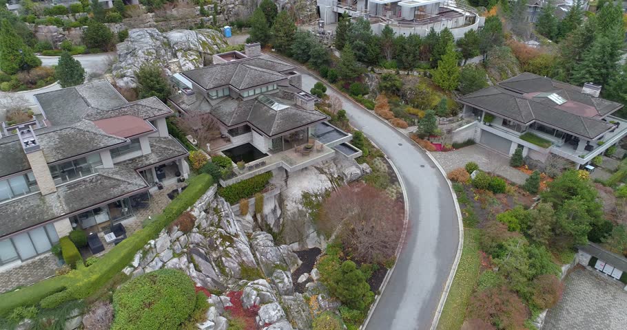 A perfect neighbourhood. Houses in suburb at Summer in the north America. Luxury houses with nice landscape. Aerial drone view. 4K.