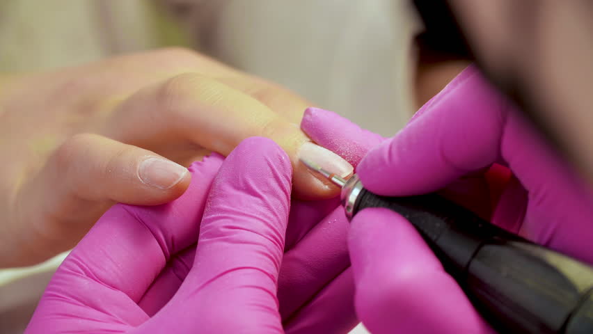 Mechanical manicure in the process of cleaning the cuticle. Close up | Shutterstock HD Video #1023480973