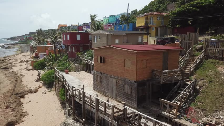 AERIAL: Circling the beautiful and colorful houses of La Perla, around Abraham Lincoln Elementary School and Christopher Columbus castle.