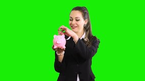 Business woman with piggy bank and euro isolated on green screen chroma key - Powered by Shutterstock - Get 15% off with code: PIKWIZARD15
