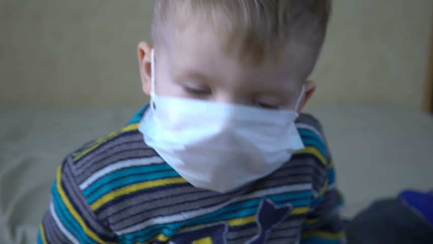 Close-up of a boy with mask. Infected sick child.