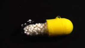 Pill Dissolve In Water. Macro Video