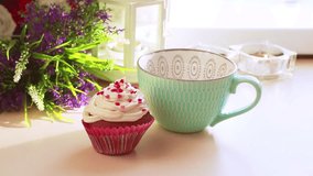 Beautiful video with a homemade cupcake, hot tea is poured into a beautiful cup
