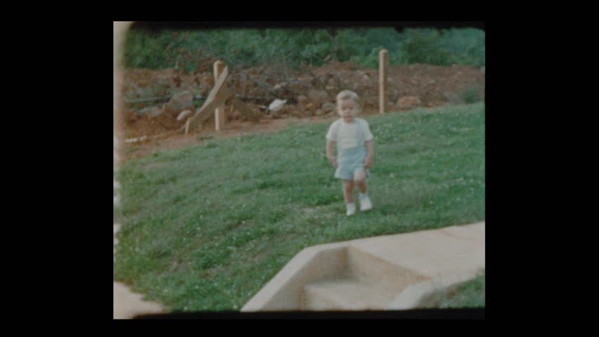 1953 Little boy slips and falls then walks away unscathed Royalty-Free Stock Footage #1023520504