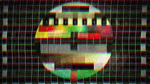 A flickering, analog TV signal with bad interference, static, and color bars.