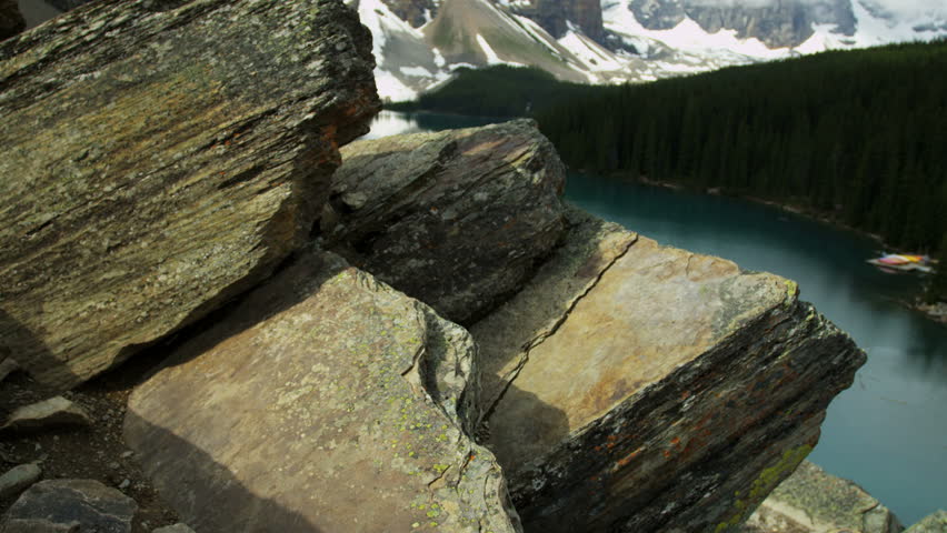 Male hiker Lake Moraine light refraction off rock flour_deposited in the lake on a continual basis, Canada RED EPIC