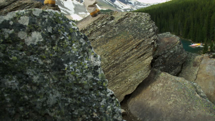 Male hiker enjoying his success and achievement viewing Lake Moraine Banff National Park, Alberta, Canada RED EPIC