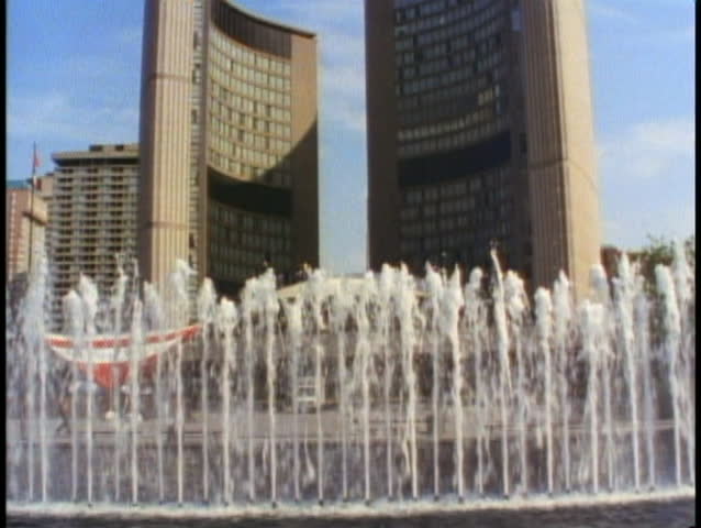 TORONTO, ONTARIO, 1990, City Hall with fountains in the foreground, wide shot
