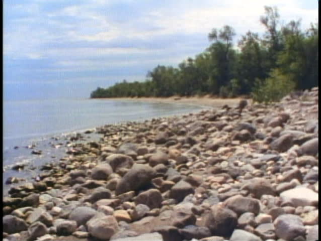 WINNIPEG, MANITOBA, 1990, Winnipeg Beach, rocks on lake shore, wide shot