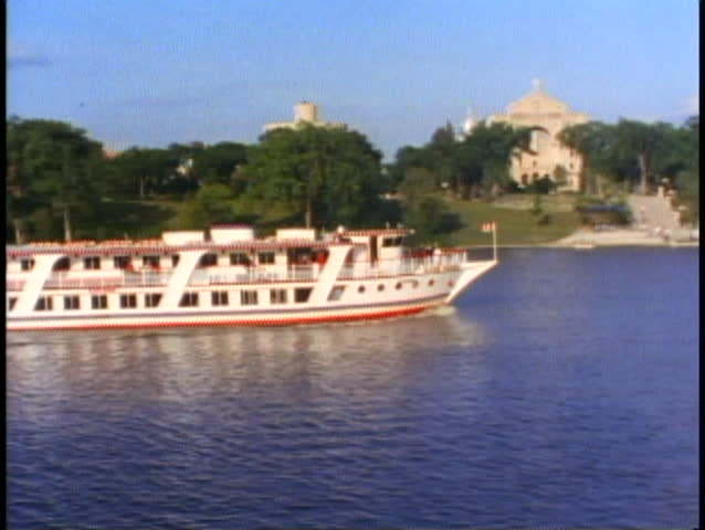 WINNIPEG, MANITOBA, 1990, Excursion boat passing on Red River