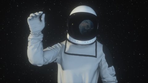 Astronaut in outer space waving the planet Earth with his hand, the earth is reflected in the spacesuit