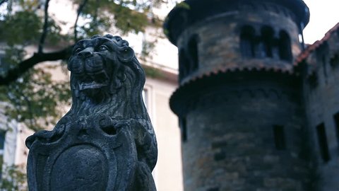Lion of Judah Sculpture on a Gravestone and the Jewish Ceremonial Hall, Josefov, Prague, Czech Republic. Close Up.