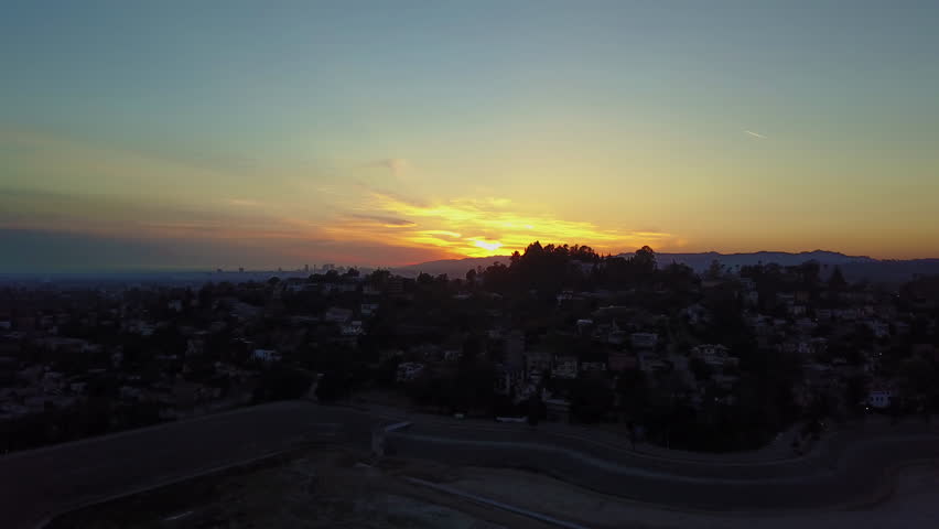 Beautiful Sunset aerial over Los Angeles, Silverlake CA - 4K Royalty-Free Stock Footage #1023551494