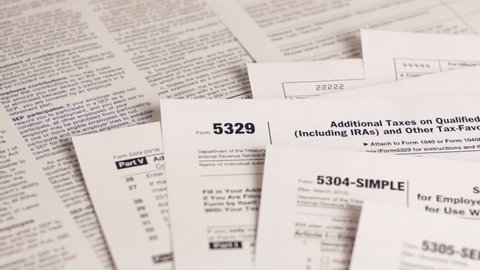Tax forms 5329, 5304-simple, 5305-ser and personal plan 401k . Close-up