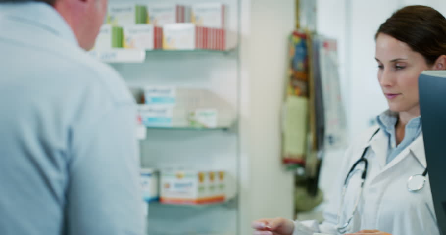 Slow motion of young woman pharmacist handing over prescribed medicines to a patient in drugs store. Shot in 8K. Concept of profession, medicine and healthcare, medical education,pharmaceutical sector Royalty-Free Stock Footage #1023572122