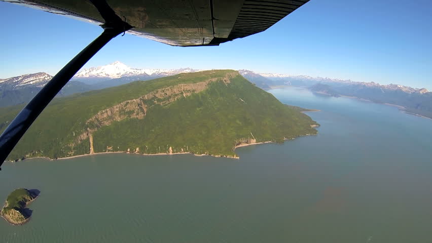 Aerial wide angled view from light aircraft Aleutian mountain range Alaskan lakes mountains and rivers remote Wilderness area Alaska, USA
