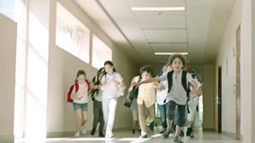 Children entering from school hallway to the classroom during recess, during school bell rings . Many Pupils Are Having Fun Before Lessons . Children running during bell ringing . - Powered by Shutterstock - Get 15% off with code: PIKWIZARD15