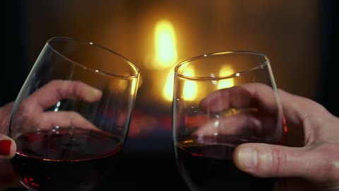 Slow Motion Romantic Wine Glass Cheers by Cozy Fireplace