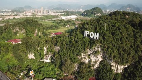 IPOH,MALAYSIA. FEBRUARY 5, 2019 : Aerial view of IPOH signage attach at mountain near highway Ipoh, Ipoh is a capital state of Perak Malaysia