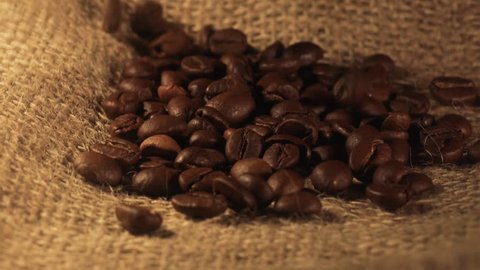 Coffee beans on the background of light burlap