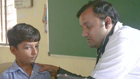 Doctor is checking child - Bhachau, Gujarat - June 2018