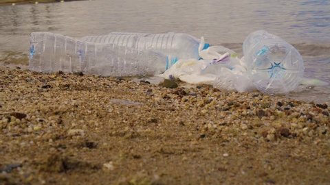 Plastic pollution in ocean environmental problem. Plastic cups,carrier bags, bottles and straws dumped in sea