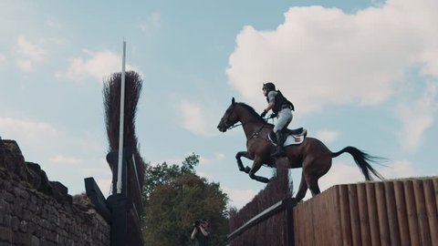 Burghley, England - September 1 2018: Horse show jump over fence in slow motion, on September 1 2018 in Burleigh, England