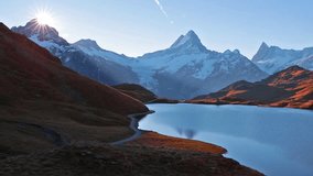 Gorgeous morning view of Bachalp lake / Bachalpsee, Switzerland. Exotic autumn sunrise in Swiss alps, Grindelwald, Bernese Oberland, Europe. Full HD video (High Definition).