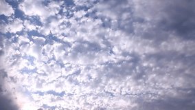 White formating big rolling clouds in summer, sunny horizon, nature clear blue skies in panoramic view, beautiful relaxing weather, fast moving away. -UHD.