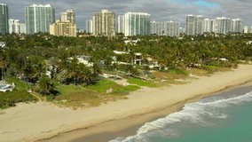 Aerial tour luxury beachfront homes Golden Beach Florida 4k