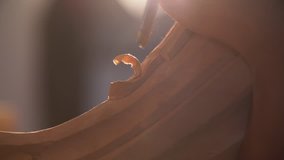 Close Up of Man’s Hands carving ornament on wooden furniture. Carpenter using tool making Artistic Wood Carving. Producing an Ornament on Wood with Chisel and Hammer on a Panel of Wood  - Powered by Shutterstock - Get 15% off with code: PIKWIZARD15