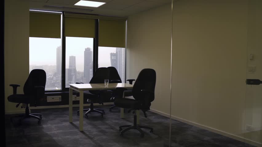 Closed empty vacant or abandoned executive office room with view to the city - no employees in closed business or company on top floor building - unemployment or recession market crash crisis no jobs Royalty-Free Stock Footage #1023649012