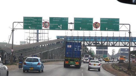 Nairobi, Kenya, 09/15/2018, Road and Traffic on the Road from Nairobi to Tsavo Park, Road Sign, Kenya, Slow Motion