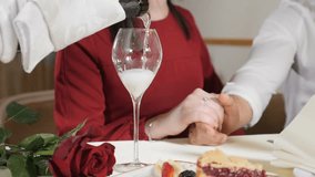 Marriage concept. Love and Romantic relations. Waiter pour champagne in glass for couple in slow motion. Closeup shot of hand and a glass with alcoholic beverage in slow motion. hd - Powered by Shutterstock - Get 15% off with code: PIKWIZARD15