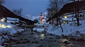 Winter morning flight over footbridge near famous Parish church St. Sebastian, in Ramsau, Berchtesgaden, Bavarian Alps Germany. - Powered by Shutterstock - Get 15% off with code: PIKWIZARD15