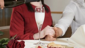 Marriage concept. Love and Romantic relations. Waiter pour champagne in glass for couple in slow motion. Closeup shot of hand and a glass with alcoholic beverage in slow motion. hd - Powered by Shutterstock - Get 15% off with code: PIKWIZARD15