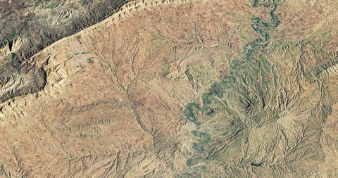 Very high-altitude overflight aerial of Zagros Mountains, adjacent plains, Iraqi Kurdistan. Reversible, seamless loop. Elements of this image furnished by NASA.
