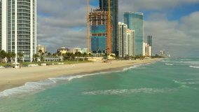 Aerial drone video Miami Beach Sunny Isles coastal highrise condominiums Atlantic Ocean
