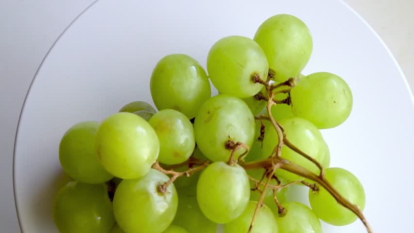 fruits-green grapes moving plate on white Stock Footage Video (100% ...