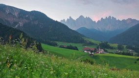 Romantic morning view of Santa Maddalena or Santa Maddalena village. Great summer scene of Funes valley. Picturesque landscape of National park, Italy, Europe. Full HD video (High Definition).