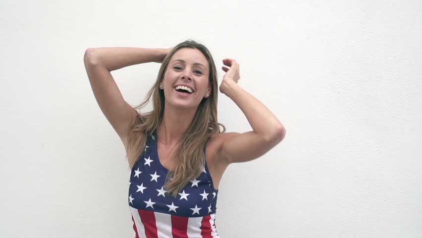 Slow motion of smily American blonde dancing outdoors on white background